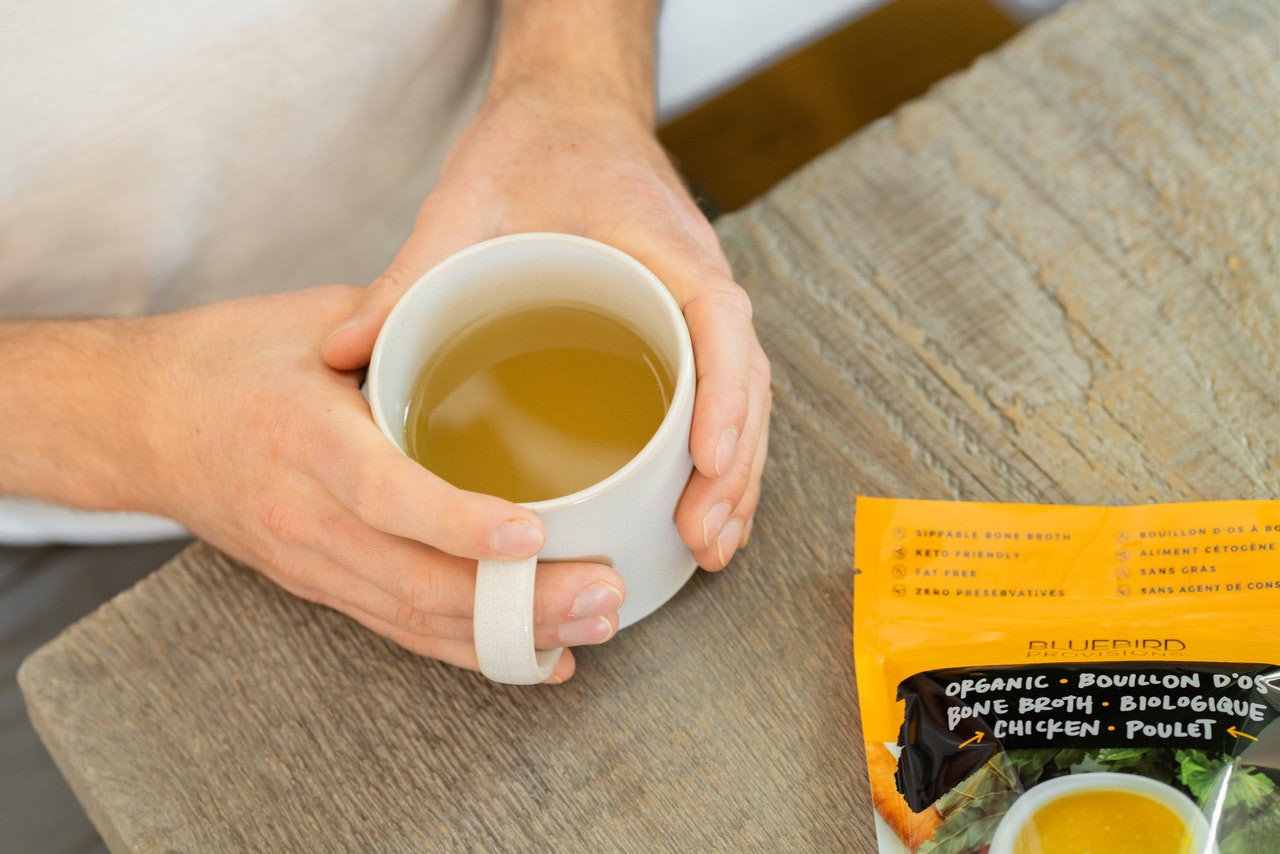 chicken bone broth in a cup